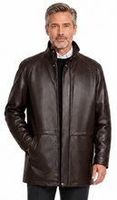 Cargar imagen en el visor de la galería, A man wearing a dark brown leather jacket, black trousers, and black dress shoes, standing against a plain white background.
