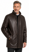 Cargar imagen en el visor de la galería, A man wearing a dark brown leather jacket, black trousers, and black dress shoes, standing against a plain white background.

