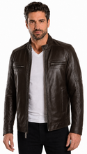Load image into Gallery viewer, A man wearing a dark brown leather jacket over a white t-shirt and black pants, standing against a plain white background.
