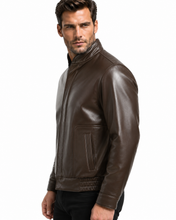Load image into Gallery viewer, A man wearing a dark brown leather jacket, shown from a side profile against a plain white background.
