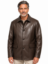 Cargar imagen en el visor de la galería, A man wearing a dark brown leather jacket with a button-up front and flap pockets, paired with light beige pants, against a plain white background.
