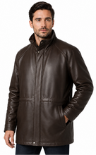 Cargar imagen en el visor de la galería, A man wearing a dark brown leather jacket with a stand-up collar, front zipper, and side pockets, photographed against a plain white background.
