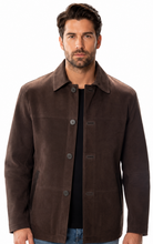 Charger l'image dans la galerie, A man wearing a dark brown suede jacket over a black shirt and blue jeans, standing against a plain white background.
