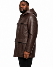 Charger l'image dans la galerie, A man wearing a dark brown textured hooded jacket, shown in profile against a plain white background.

