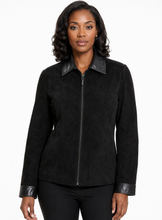 Charger l'image dans la galerie, A woman modeling a black suede-like zip-front jacket with contrasting black leather-look collar, cuffs, and hem, photographed against a plain white studio background.
