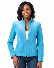 Cargar imagen en el visor de la galería, A woman modeling a bright turquoise blue zip-up jacket with a stand collar, worn over a white top and blue jeans, against a plain white background.
