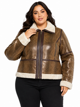 Cargar imagen en el visor de la galería, A woman modeling a brown faux-snakeskin-textured jacket with a cream sherpa collar, cuffs, and hem, paired with black pants against a plain white background.
