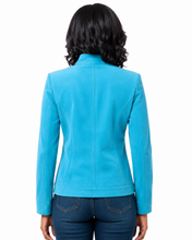 Cargar imagen en el visor de la galería, A woman viewed from the back wearing a bright turquoise blue long-sleeve jacket and dark blue jeans against a plain white background.
