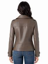 Load image into Gallery viewer, A woman viewed from the back wearing a fitted brown real-leather jacket with shoulder epaulets and blue jeans, against a plain white background.
