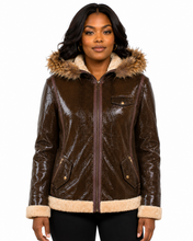 Charger l'image dans la galerie, A woman wearing a brown real-croc-textured hooded jacket with a beige faux-fur trimmed hood and cuffs, photographed against a plain white background.
