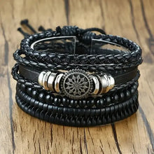 Load image into Gallery viewer, Black braided wrap leather bracelet with metal accents on a wooden background.

