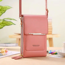 Load image into Gallery viewer, Chic pink 2-in-1 leather bag on table, transforms from handbag to crossbody, showcases versatility and elegance.
