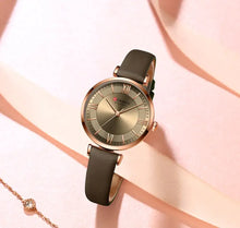 Load image into Gallery viewer, Elegant Classic Clock Leather Watch with a leather strap and quartz movement, ideal for women&#39;s fashion outfits, casual or formal.
