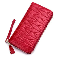 Load image into Gallery viewer, Red leather female travel purse with textured design and wrist strap, perfect for organizing travel essentials in style.
