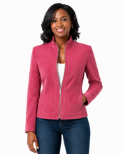Cargar imagen en el visor de la galería, A woman modeling a pink zip-up jacket with a stand collar, paired with a white top and blue jeans, against a plain white background.
