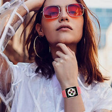Load image into Gallery viewer, Stylish woman wearing Apple Watch with pink nylon strap and red sunglasses, showcasing modern fashion and smartwatch accessory.
