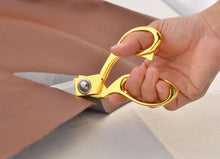 Load image into Gallery viewer, Person using eZthings heavy duty scissors to cut fabric, ideal for arts and crafts, hobby, or commercial use.
