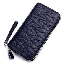 Load image into Gallery viewer, Black leather travel purse for women with a stylish zigzag design and secure zip closure, perfect for organizing travel essentials.

