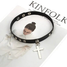 Load image into Gallery viewer, Harajuku oversized choker necklace with 5cm cross pendant on fashion magazine background.
