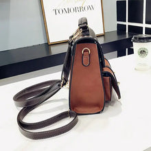 Load image into Gallery viewer, Vintage paneled PU leather women&#39;s backpack with adjustable straps, showcased on a table, perfect for stylish, vegan-friendly fashion.
