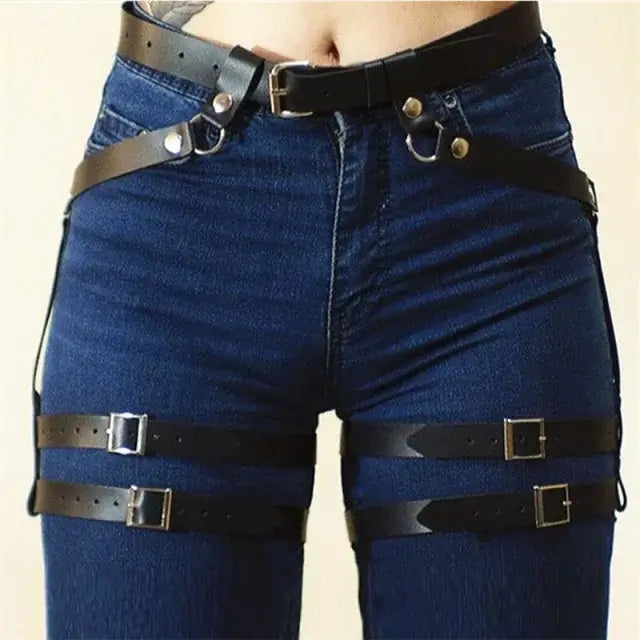 Leather sword belt waist garter worn over jeans, stylish medieval costume accessory.
