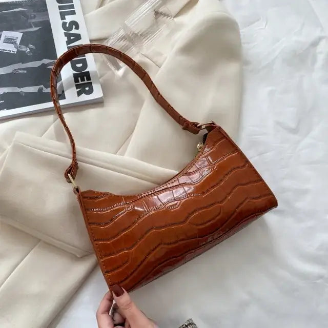 Elegant brown vegan leather shoulder bag on white background