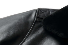 Load image into Gallery viewer, Close-up of REED Men&#39;s Premium Leather Aviator Bomber Jacket showing soft, durable imported leather and black fur collar.
