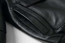 Load image into Gallery viewer, Close-up of REED Men&#39;s leather aviator bomber jacket pocket showcasing durable, premium soft leather craftsmanship.

