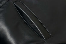 Load image into Gallery viewer, Close-up of pocket detail on REED 34&#39;&#39; Raglan Car Coat in Imported Lamb leather with sleek lining.

