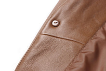 Load image into Gallery viewer, Close-up of REED men&#39;s lambskin leather blazer showing button detail and fine stitching.
