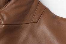 Load image into Gallery viewer, Close-up of REED Men&#39;s Premium Lambskin Leather Blazer showcasing soft, durable brown leather texture and stitching details.
