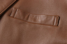 Load image into Gallery viewer, Close-up of REED Men&#39;s Lambskin Leather Blazer showcasing premium brown leather texture and stitching detail.
