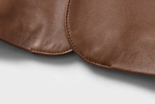 Load image into Gallery viewer, Close-up of brown lambskin leather from REED Men&#39;s Blazer Sports Jacket, showcasing soft-touch texture and premium quality material.
