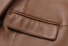 Load image into Gallery viewer, Close-up of REED Men&#39;s Premium Lambskin Leather Blazer in brown, showcasing soft-touch leather and meticulous stitching. Ideal for timeless style.
