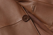 Load image into Gallery viewer, Close-up of REED Men&#39;s Premium Lambskin Leather Blazer button and texture, showcasing the luxurious soft-touch quality of the garment.
