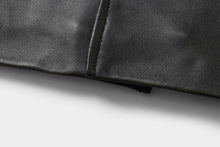 Load image into Gallery viewer, Close-up of genuine lambskin leather from REED EST. 1950 Men&#39;s Jacket, showcasing the premium craftsmanship and soft texture.
