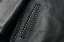 Load image into Gallery viewer, Close-up of the REED EST. 1950 Men&#39;s Jacket in black genuine lambskin leather with stitching detail.
