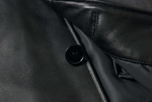 Load image into Gallery viewer, Close-up of REED EST. 1950 men&#39;s lambskin leather jacket showing button detail and soft lining.
