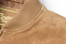Load image into Gallery viewer, Close-up of REED Men&#39;s Baseball Suede Leather Jacket featuring soft suede texture and satin lining, perfect for fall and spring.
