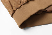 Load image into Gallery viewer, Close-up of the elastic cuff on a REED men&#39;s baseball suede leather jacket, showcasing detailed stitching and quality materials.
