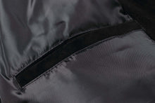 Load image into Gallery viewer, Close-up of REED Men&#39;s Baseball Suede Jacket&#39;s satin lining showing sleek black fabric and precise stitching.
