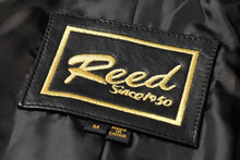 Load image into Gallery viewer, REED brand label on black fabric with gold embroidery, featuring text &#39;Reed Since 1950&#39; and &#39;Made in China&#39; tag.
