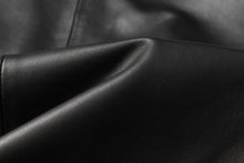 Load image into Gallery viewer, Close-up of premium lambskin leather texture from REED Men&#39;s blazer, showcasing luxurious softness and quality craftsmanship.
