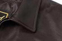 Load image into Gallery viewer, Close-up of REED Men&#39;s New Zealand lambskin leather jacket collar, showcasing soft-touch black leather material.
