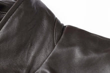 Load image into Gallery viewer, Close-up of REED Men&#39;s New Zealand lambskin leather jacket showing soft, smooth black leather texture.
