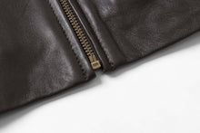 Load image into Gallery viewer, Close-up of black lambskin leather jacket with zipper detail, showcasing soft texture. Ideal for style and comfort by REED.
