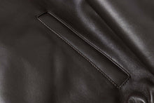 Load image into Gallery viewer, Close-up of REED Men&#39;s New Zealand lambskin leather jacket in black, showing the fine stitching and soft, smooth finish.
