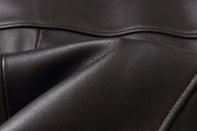 Load image into Gallery viewer, Close-up of genuine lambskin leather texture from REED EST. 1950 Men&#39;s Jacket, showing premium quality and softness.
