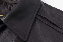 Load image into Gallery viewer, Close-up of black leather aviator bomber jacket collar highlighting premium craftsmanship and texture by REED.
