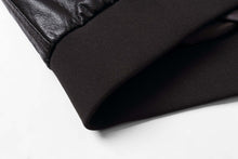 Load image into Gallery viewer, Close-up of REED Men&#39;s Premium Leather Aviator Bomber Jacket showing knit cuffs and leather texture.
